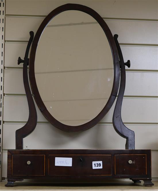 A skeleton frame inlaid toilet mirror